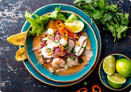 A bowl of Peruvian ceviche with lime and cilantro